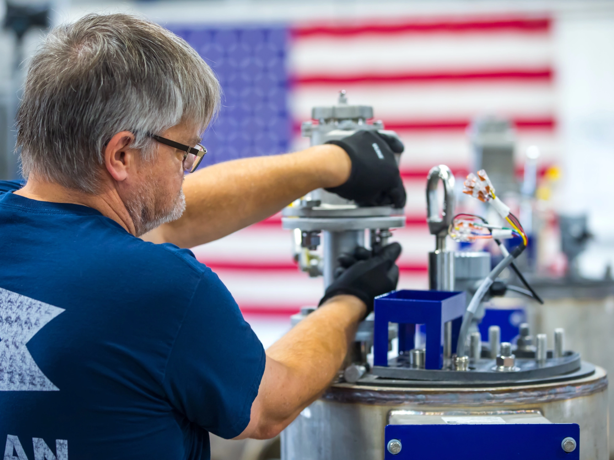 A Bergan craftsman working on some equipment.