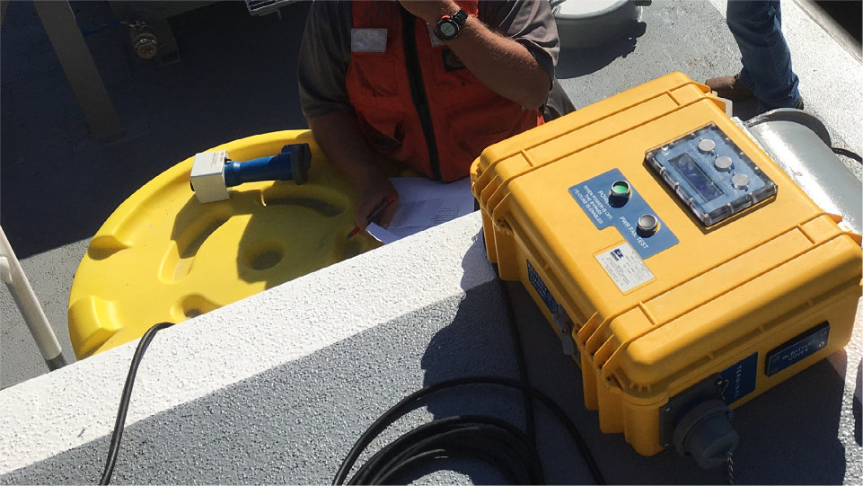 A photo of a Portable Alarm Unit on a barge.